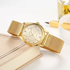 Montre de luxe dorée élégante avec diamants pour femme