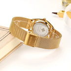 Montre de luxe dorée élégante avec diamants pour femme