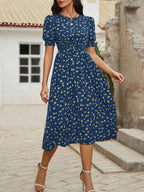 Robe florale bohème à manches bouffantes et col rond